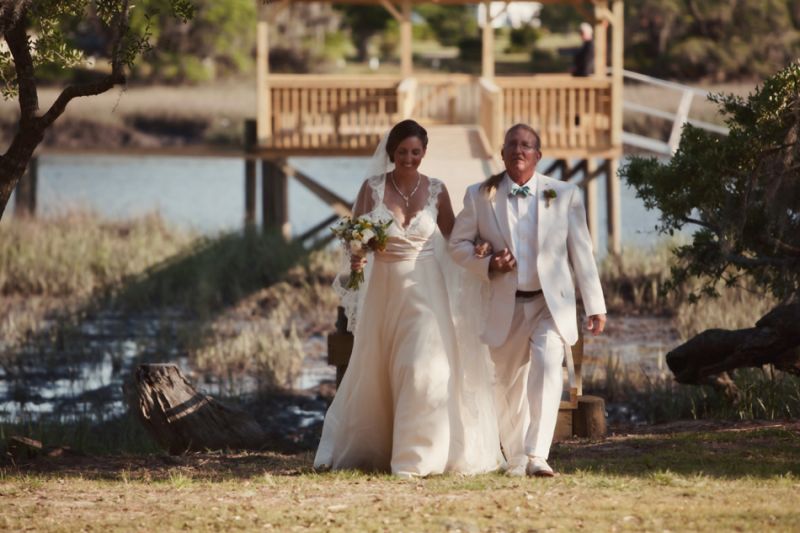 NATURAL BEAUTY: On her Big Day, Lindsey held a timeless elegant look in her Amsale gown complete with a lace-edged veil and bouquet of wild flowers.