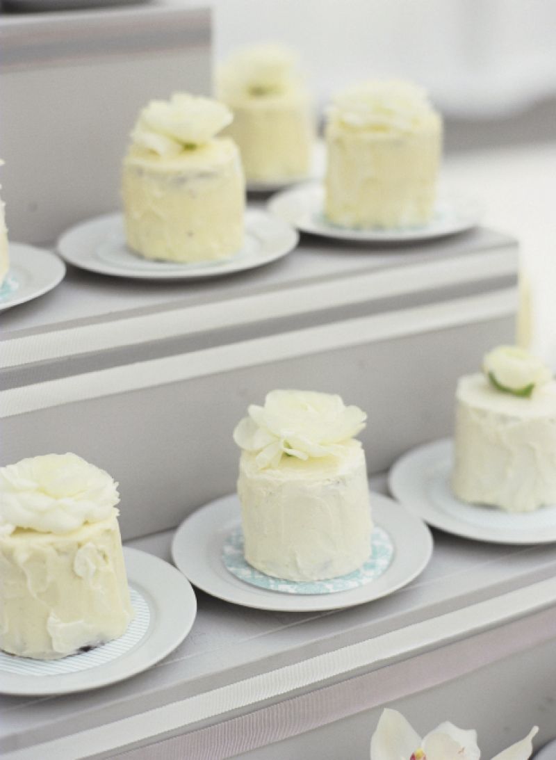PEEP SHOW: Patterned paper peeked out from beneath the mini cakes from A Matter of Taste, brightening the neutral-hued dessert spread. The tiered display echoed the shape of a traditional confection.