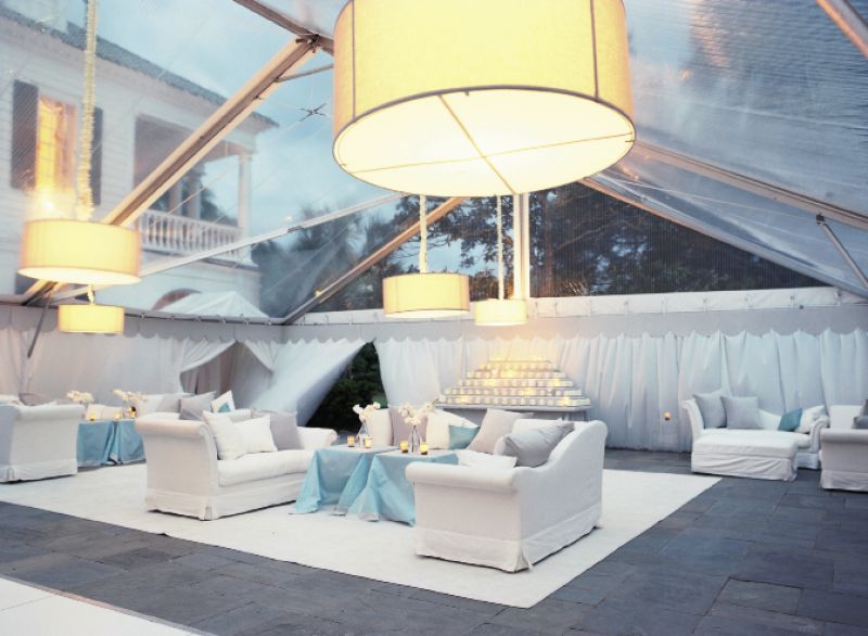 SETTLE IN: The lounge was made cozy by layered carpets, plush couches from Snyder Event Rentals, and large drum-shaded lights.