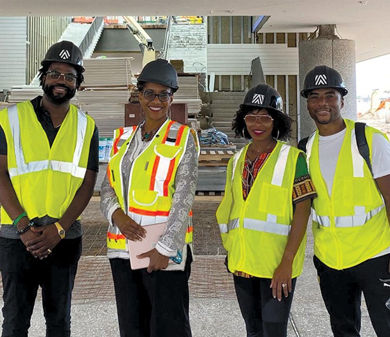 Hard Hats, Clear Vision: With construction almost complete, Matthews and her team are finalizing exhibits and programming. Here, she leads a tour for South Carolina Representative JA Moore (left); IAAM board member Lenard Larry McKelvey, a Moncks Corner native and TV and radio personality known as “Charlamagne tha God;” and his wife, Jessica Gadsden.