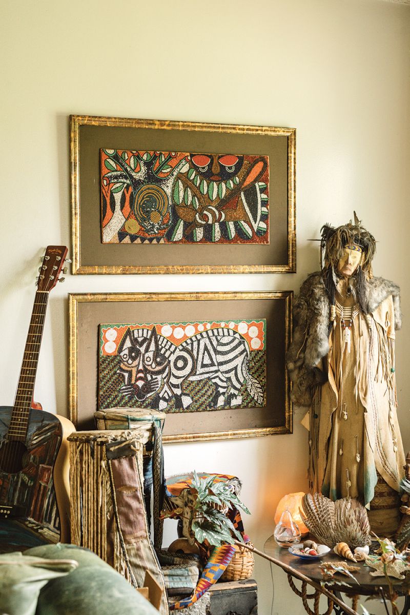 In Comer’s living room, beaded art from Africa hangs next to a Native American protector warrior doll for which she bartered a coat she batiked with native symbols.