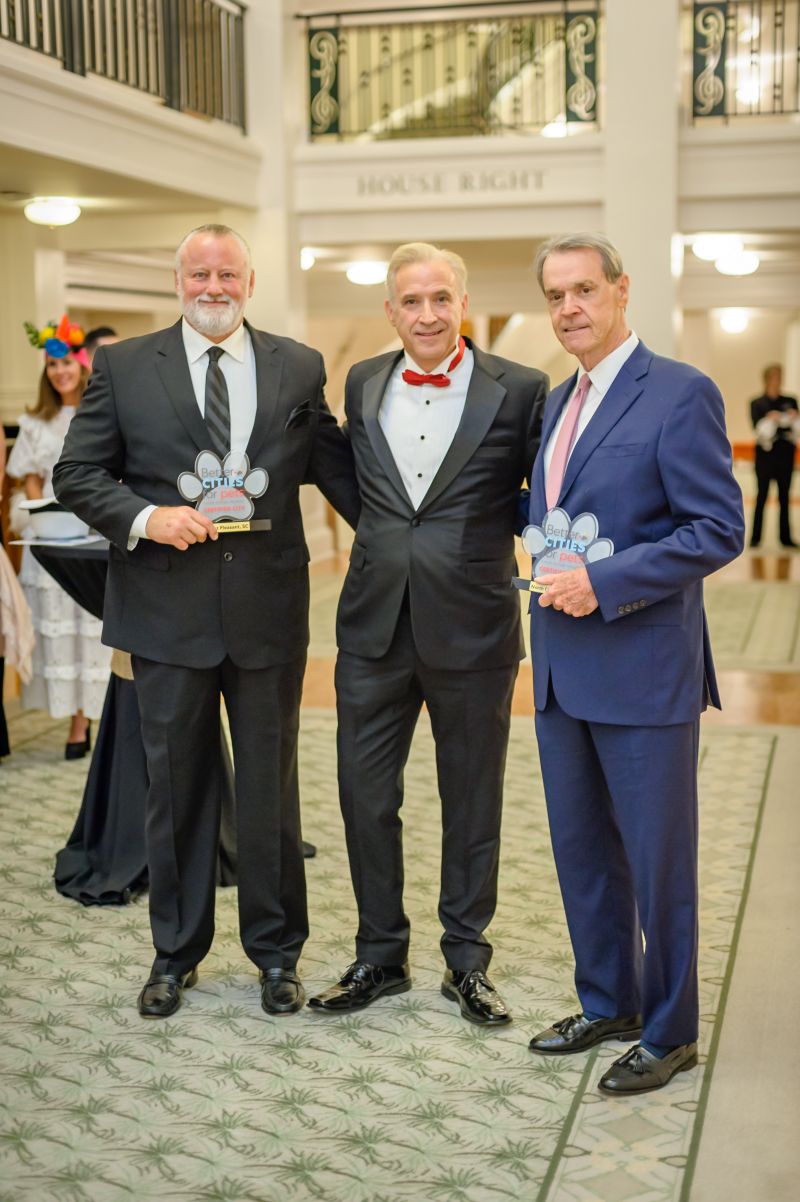Charleston Animal Society CEO Joe Elmore (center) with Better Cities for Pets award recipients Carl Ritchie and Ron Brinson