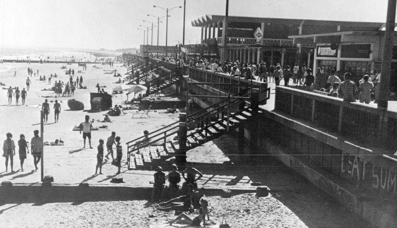 A staircase leads to the beach at Oceanfront Plaza