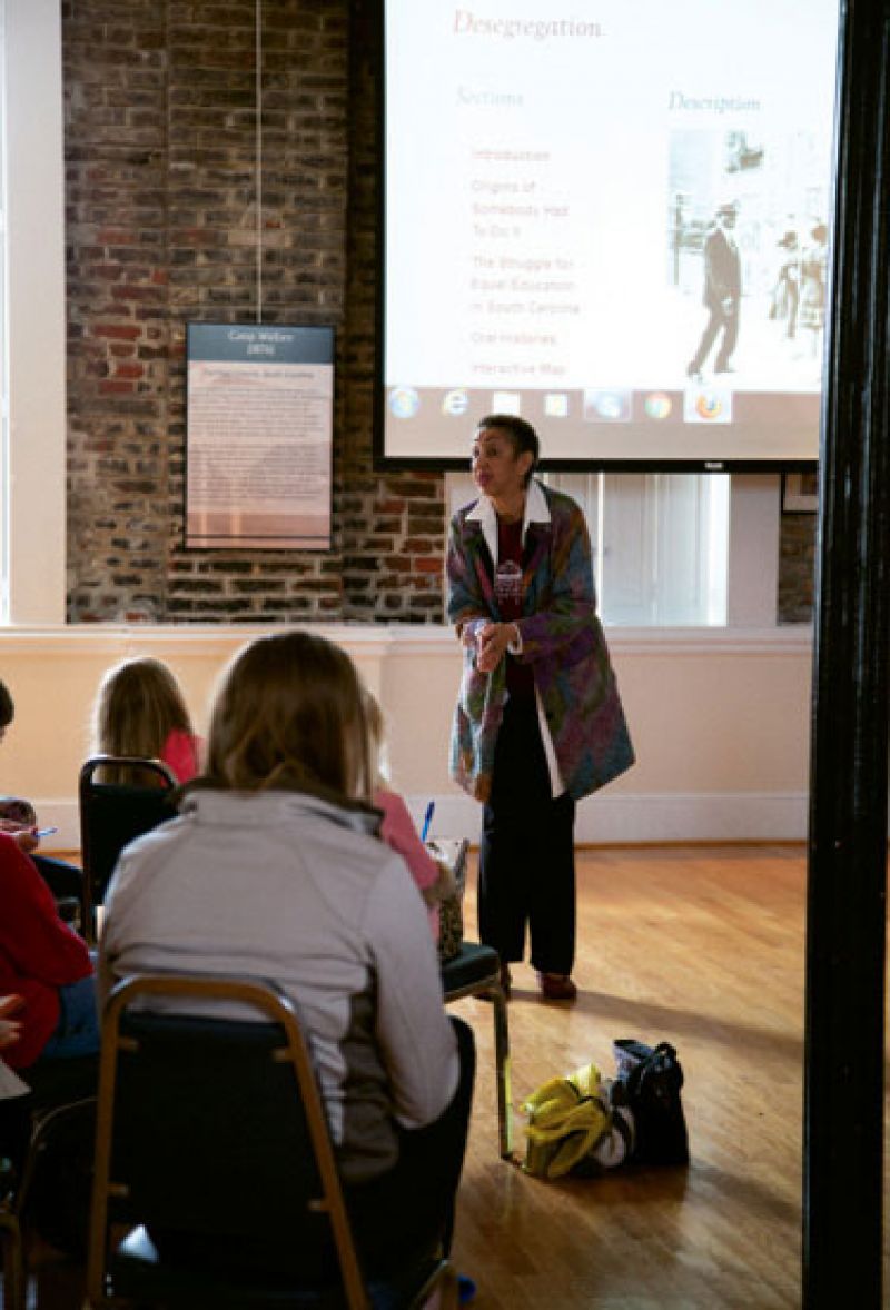 Lesson Plans: Brown travels to interview other “first children” and to speak to universities, schools, and groups, as seen here at the Avery Research Center, telling the “Somebody Had to Do It” story. “Were you scared?” a Montessori third grader asked at the end of the talk. “Yes,” she said. “I was scared.”