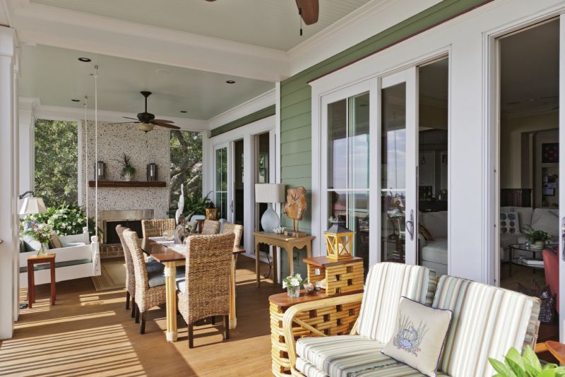 local builder Carl Derick crafted the couple’s porch dining table, and the chairs were purchased from Steinmart.