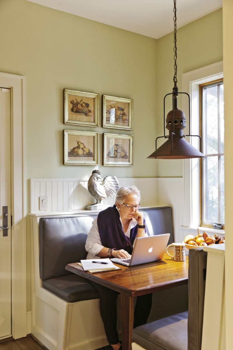 Becky Hollingsworth at work in the breakfast nook.