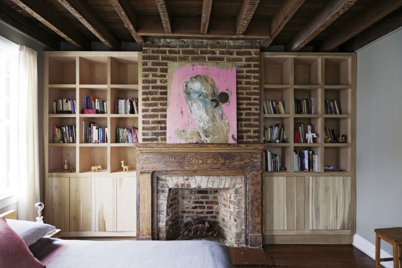 Modern art by Tim Hussey brightens the guest room