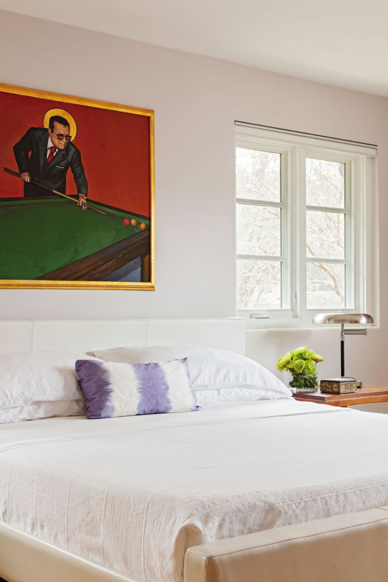 ART WORKS: Christopher is on the board of directors at Redux Studios; his passion for art is reflected in the painting by area artist Bob Snead that hangs in the master bedroom.