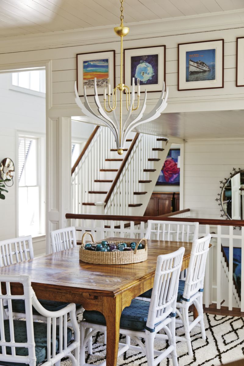 “With the upstairs being so open and loft-like, you have to be careful about the weight of the lights,” notes Lynne. “You don’t want these heavy, huge masses.” A sculptural chandelier by local design firm Avrett does the trick, illuminating without interrupting flow.