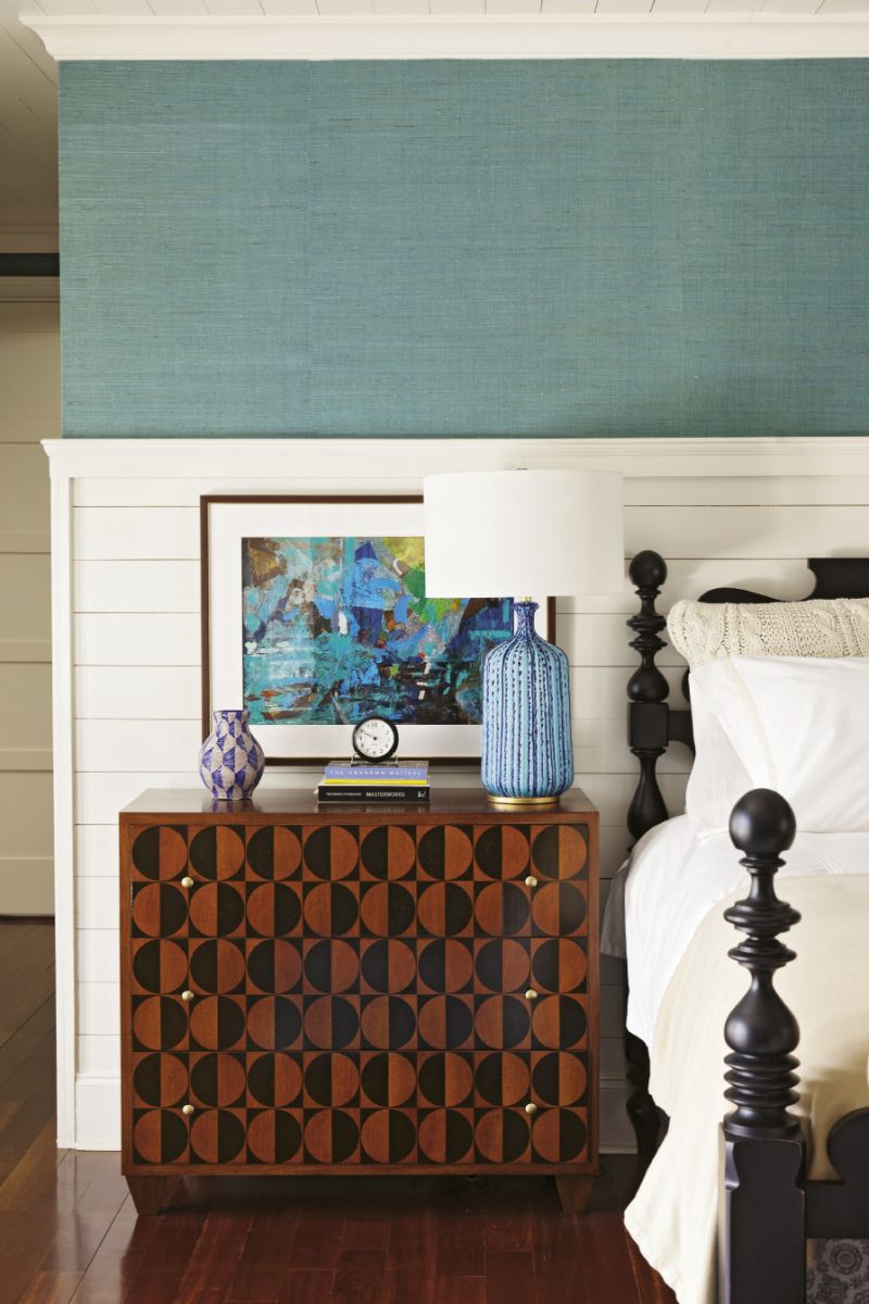 Walnut and mahogany bureaus add graphic punch in the master bedroom.