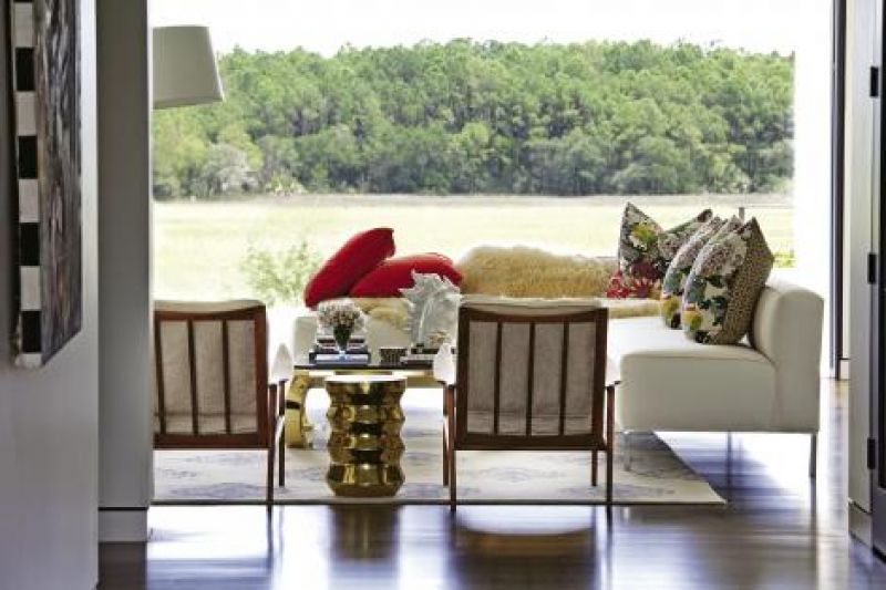 The Louis XVII-inspired chairs are upholstered in white vinyl.