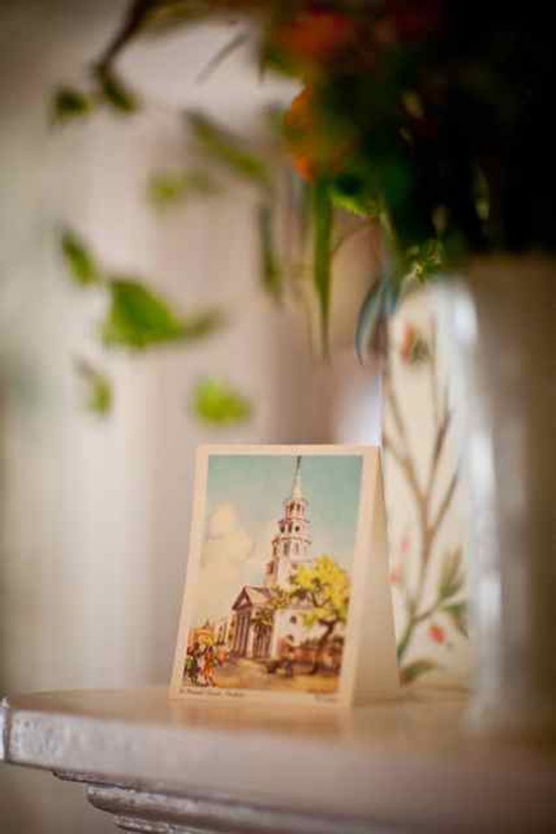 A WORK OF ART: Catherine says she spent months scouring vintage stores for all the elements of their DIY wedding, including vintage watercolors of Holy City scenes. This décor idea inspired the bride to create her own drawing of their ceremony site, which she gifted to her husband-to-be.