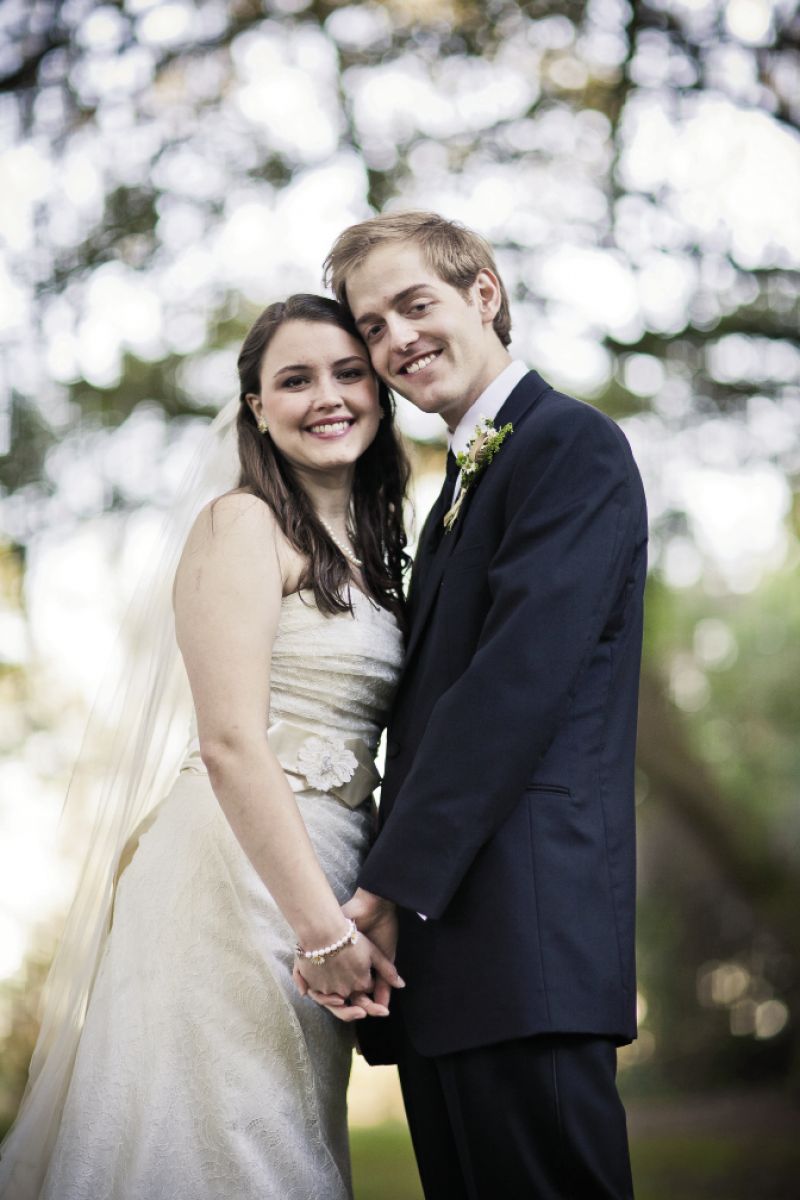 SOMETHING OLD: Catherine tied on her mother’s flowered wedding gown sash. Zack wore a JoS. A. Bank suit.