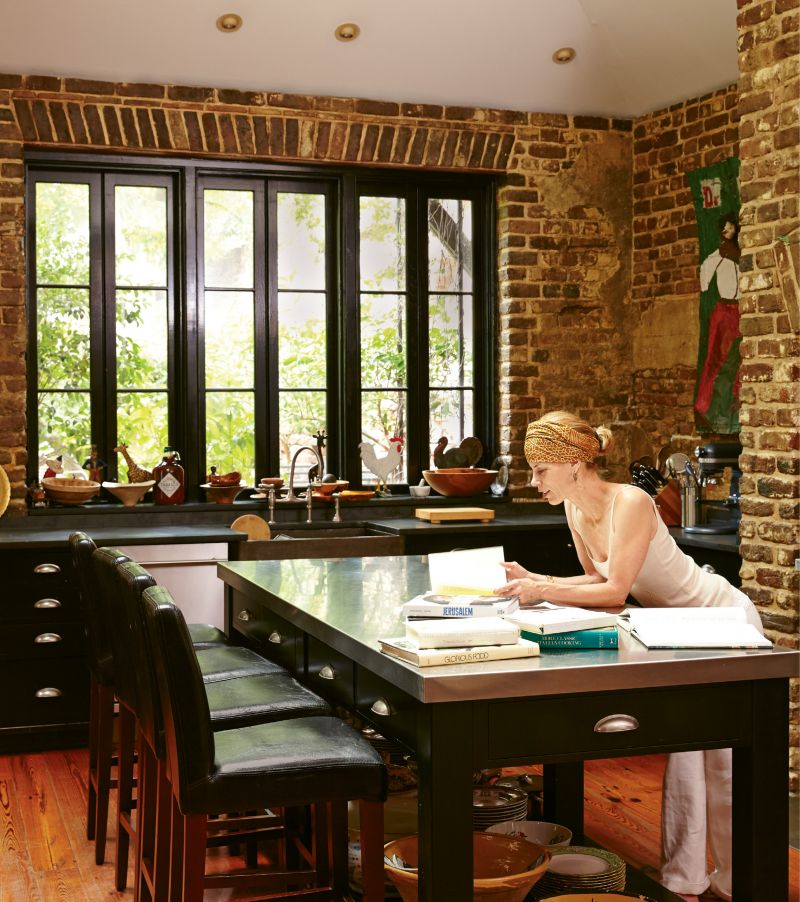 KITCHEN CONFIDENCE: Suzanne Pollak, also known as “The Dean” of The Charleston Academy of Domestic Pursuits, brings her culinary skills and global aesthetic to a traditional townhome on Rainbow Row.