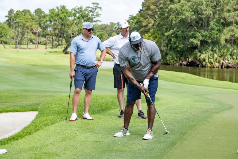 Celebrity golfers, including retired New York Giants linebacker Corey Miller, teed off on the River Course.