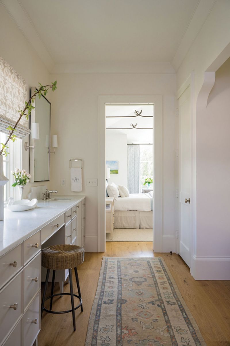 soaking it in: The en suite provides plenty of space thanks to a long, built-in vanity painted in “Repose Gray” by Sherwin Williams. A small nook to the right houses a soaking tub, in which their grandkids love to play.