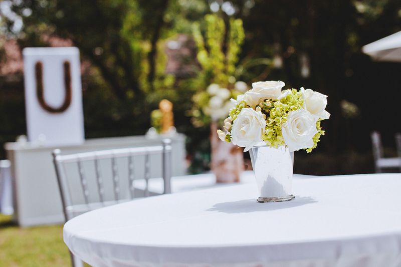 STUNNING SET: Silver vessels matched cocktail tables’ Chiavari chairs.
