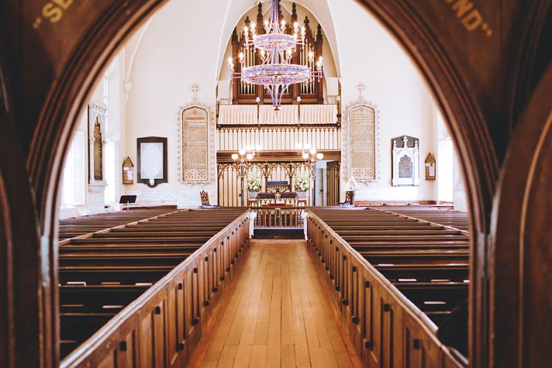 UNDER THE ARCH: The gothic revival style architecture of The Huguenot Church brought historical and romantic charm to the ceremony.