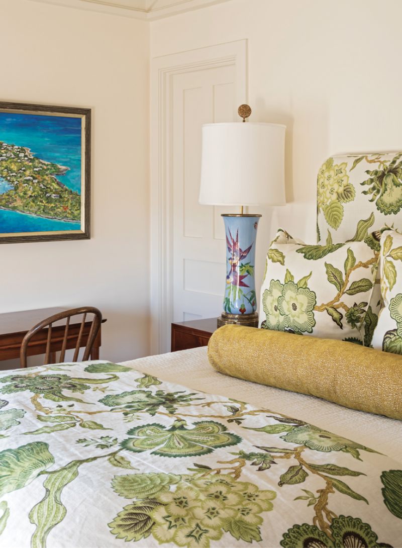 Color them Happy: In contrast to the more subdued palette of the main floor, the upstairs guest bedrooms are vibrant with color. From verdant green reflected in the headboard and coverlet and pillows in Schumacher’s “Hothouse Flowers.”
