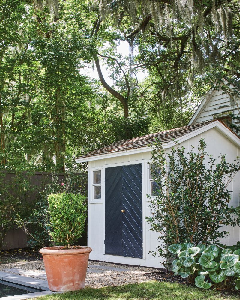 The team gave the existing shed a facelift and repositioned it within the lot; a new pool and lush lawn complete the scene.