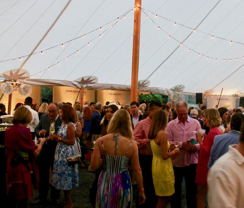 Impending rain drove the party off the  street and underneath an expansive tent in  the courtyard of the Gibbes.