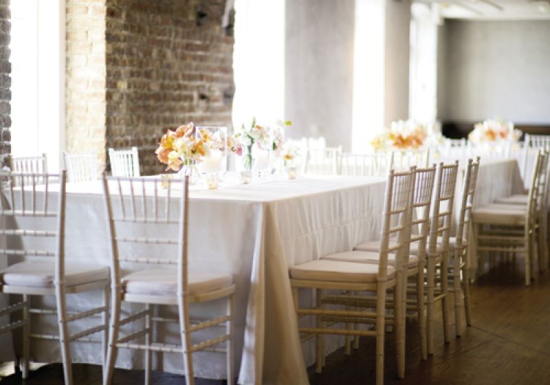 OPEN INVITE: Tone-on-tone white and ivory furniture and linens allowed sweet clusters of peach, melon, and orange flowers to stand out.