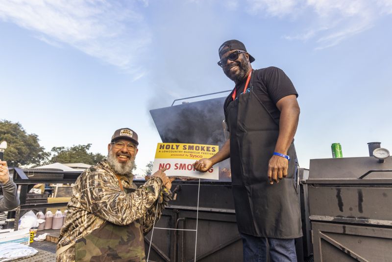 Local pit masters Rodney Scott and Anthony DiBernardo joke around at the Holy Smokes BBQ Festival.