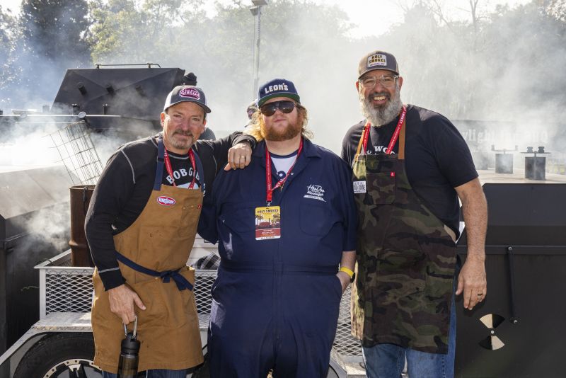 Alabama’s Chris Lilly and Connecticut’s Christopher Sexton pose with Swig &amp; Swine owner Anthony DiBernardo.