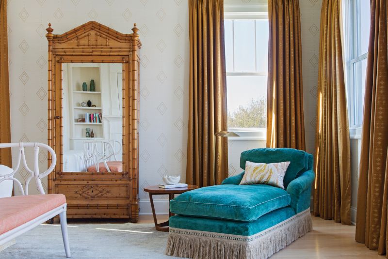 A faux bamboo wardrobe from Fritz Porter, custom drapes in a Muriel Brandolini fabric from Holland &amp; Sherry, and vintage chaise in Pierre Frey velvet add a touch of Hollywood flair and elegant romance.