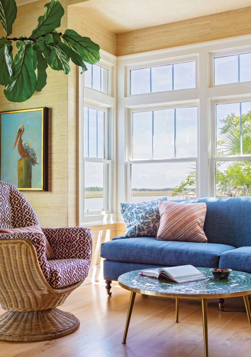 The light-filled sitting area with a blue linen sofa from Jayson Home in Chicago is Rebecca’s favorite morning perch.
