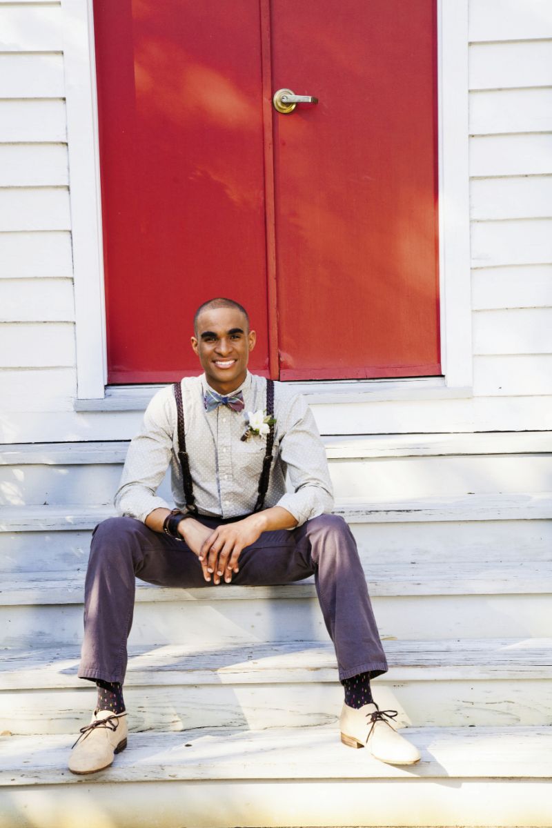 STEP UP: Gitman Bros. polka-dotted chambray shirt, Happy Socks with confetti dots, and Billy Kirk’s leather cuffs, all from Indigo and Cotton. Canvas chinos and canvas “Indianola” chukka boots, both from Billy Reid. Brinko Ties’ “Hippy Chic” plaid reversible bow tie from Rogue Wave Surf Shop. Braided leather suspenders from Brooks Brothers.