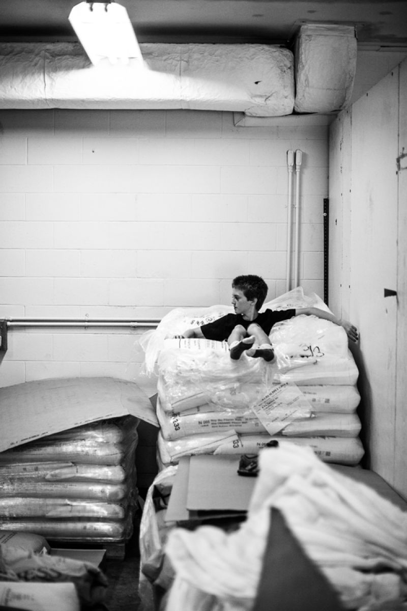 Son Aiden takes a needed break on a stack of grain.