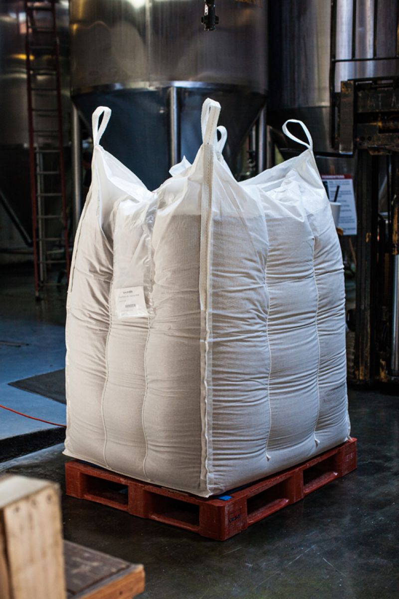 A pallet of malted barley rests waiting to be milled, and mashed