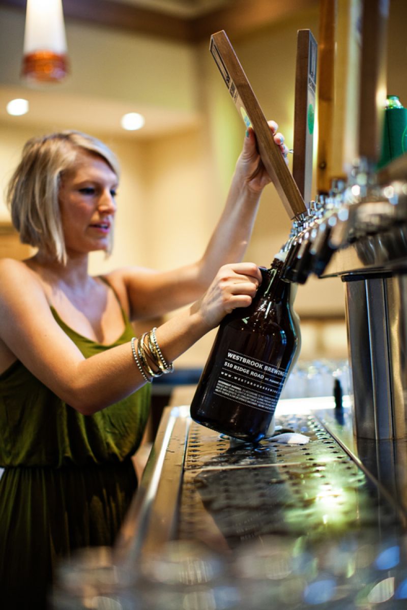 Morgan fills a growler to go.