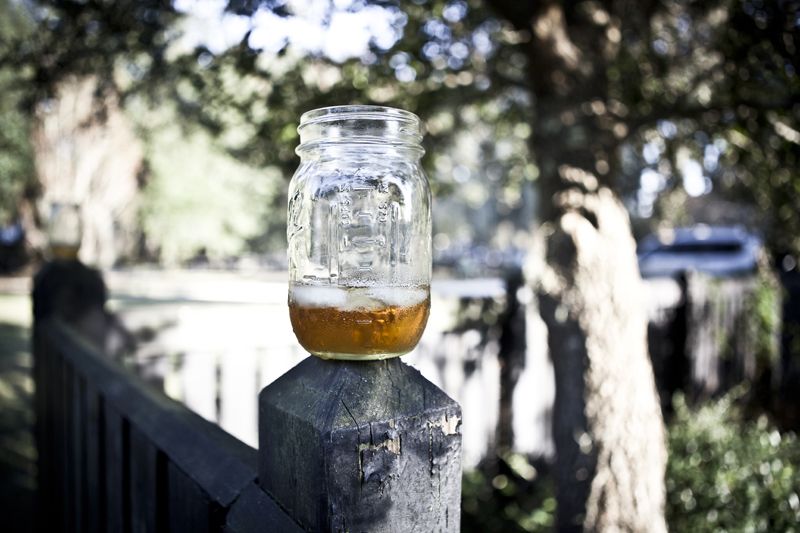 EASY LIVING: Mason jars delivered the “rustic, elegant, and fun” vibe Ashley says she and John were aiming for.