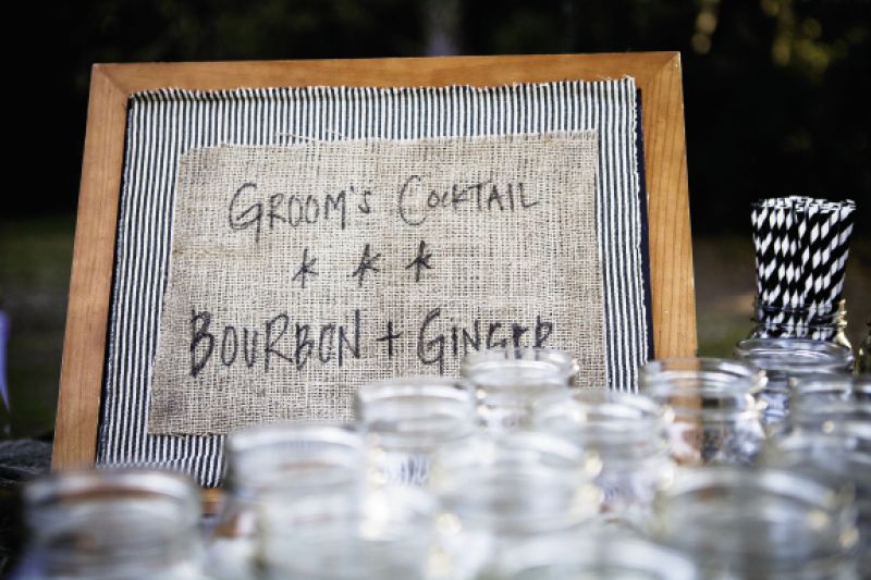 SPECIALS BOARD: For bar signage, Ashley glued striped fabric and burlap to thrift store chalkboards and inked on the offerings.