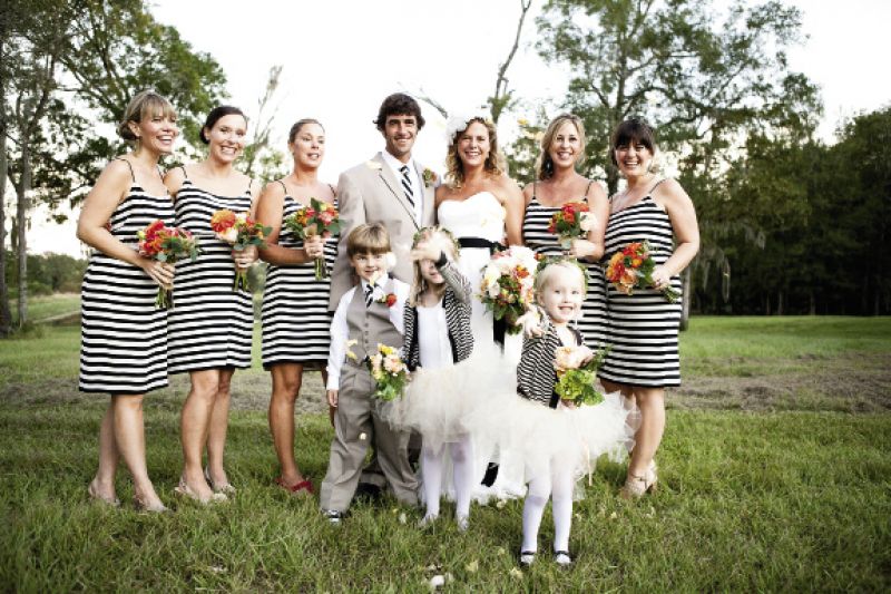 ALL IN LINE: The bridesmaids’ J.Crew dresses inspired the black and white theme. “I liked the graphic element because it was just so unique,” Ashley says. The groom’s and groomsmen’s ties, from Harper Poe’s Proud Mary, were a masculine match.