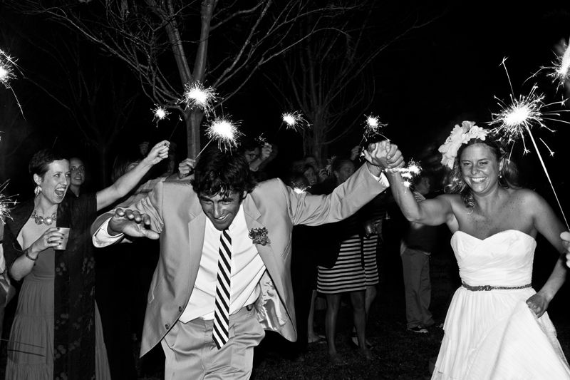 ON THEIR WAY: Guests showered the newlyweds in sparkles as they exited the reception. What came next for the couple? A honeymoon in Cabo San Lucas.