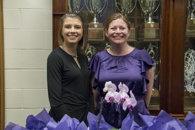 Kenzie Abernethy and Devin Kociuruba man the goodie bag and swag booth.