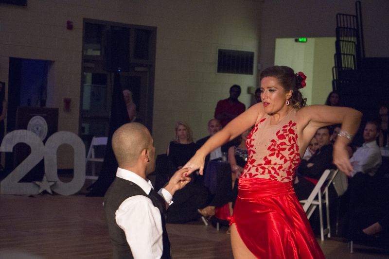 Professional dancers Cesar Lozada and Marina Fridmanovich entertain party attendees.