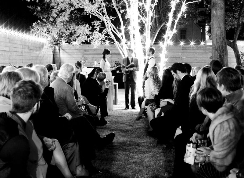 HOUSE PARTY: Once Tim and Elise thought of the huge backyard, sweeping orange tree, and exposed light bulbs of Josh Nissenboim and Helen Rice’s downtown home, their venue choice was a no-brainer.