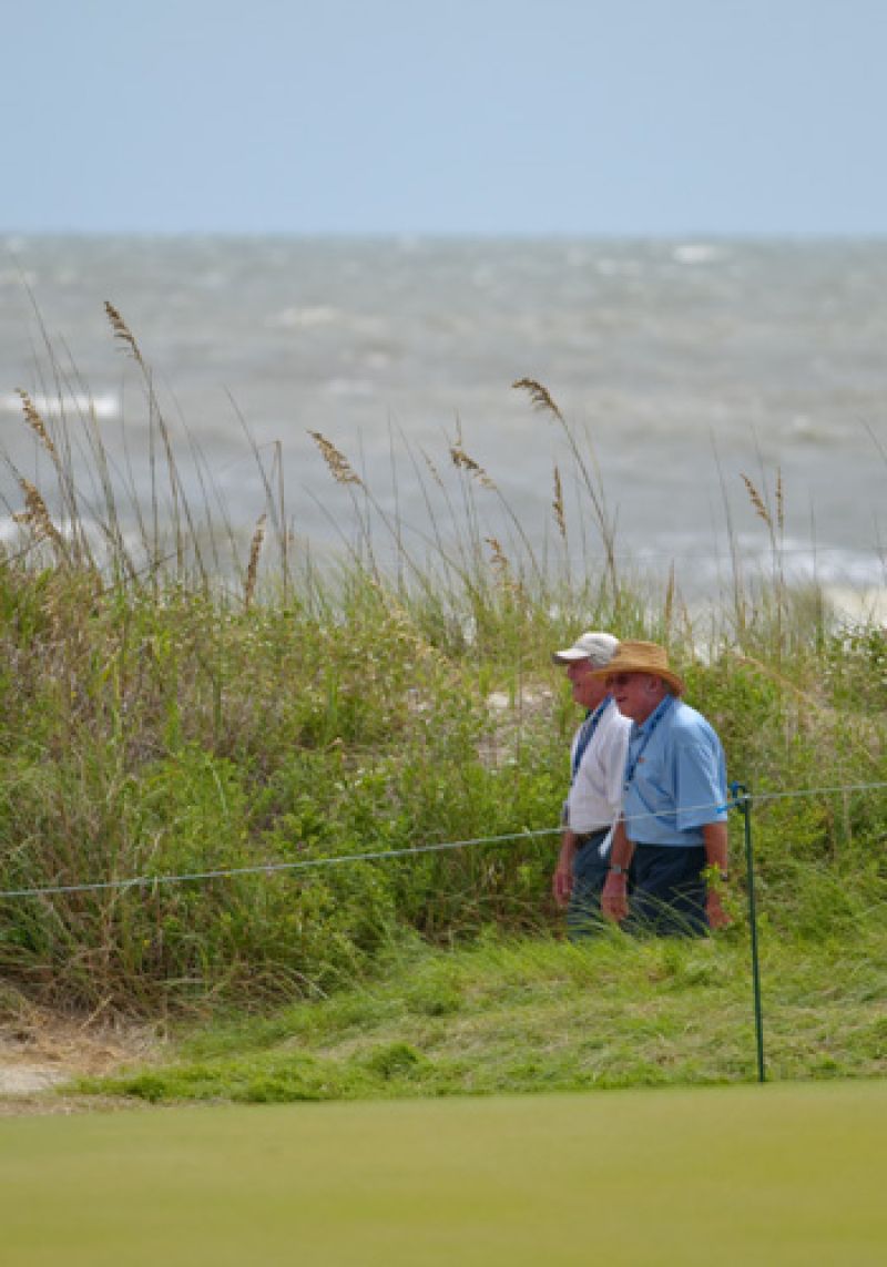 Two walking along the 16th hole.