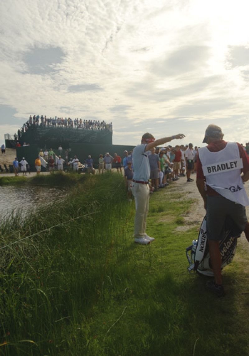 Keegan Bradley dropping after hitting his tee shot waaaay left on the par 5 11th.