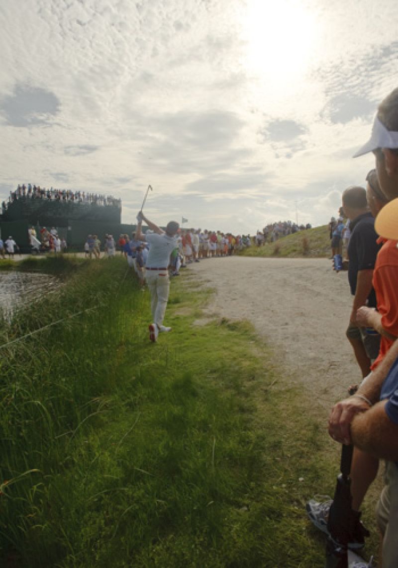 Keegan Bradley threads the needle up over the hill back onto the 11th fairway.