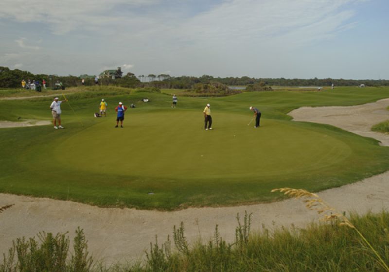 Putting on the 10th green.