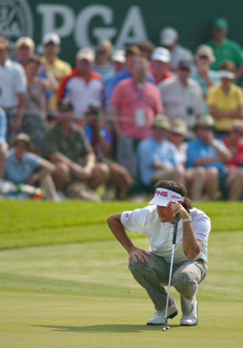 Bubba Watson studying the green before finishing his tournament on 18.