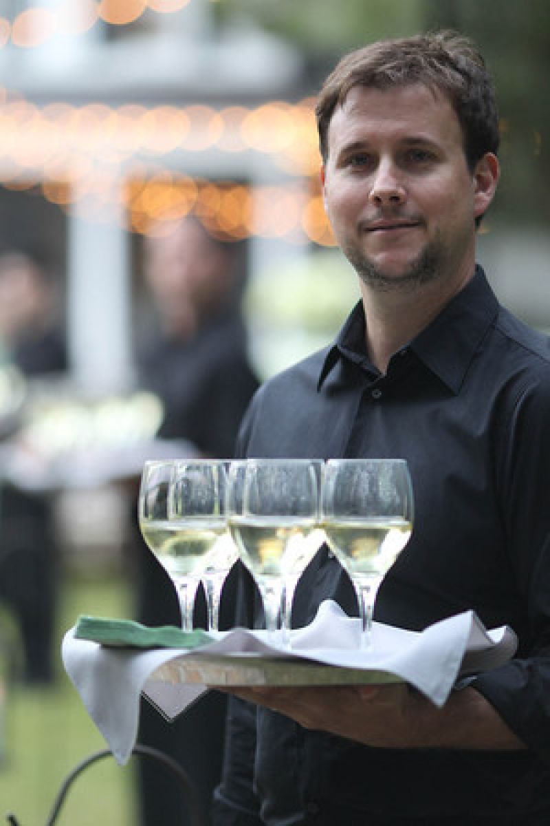 SERVING IT UP: Cru Catering delighted those unfamiliar with Lowcountry fare. Says Kiften, “Many of our guests were out-of-state, and they were definitely loving the southern cuisine.”