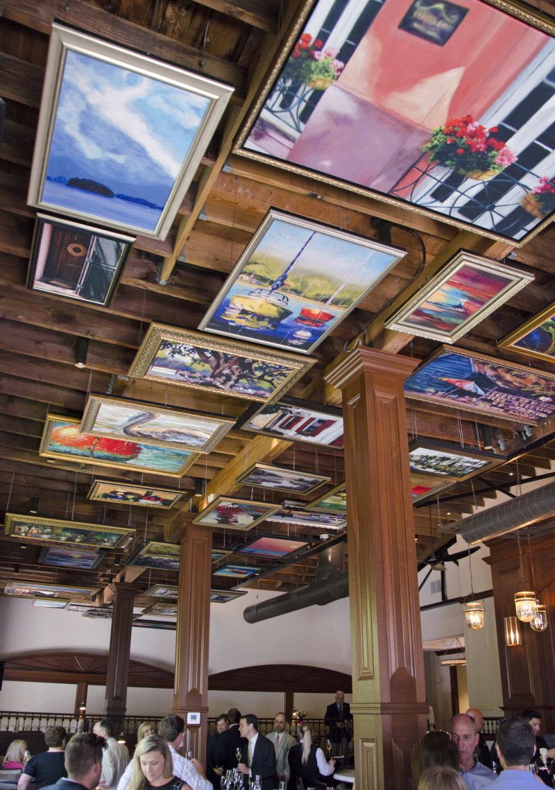 Paintings from the Lowcountry Artists Gallery lined the ceiling.