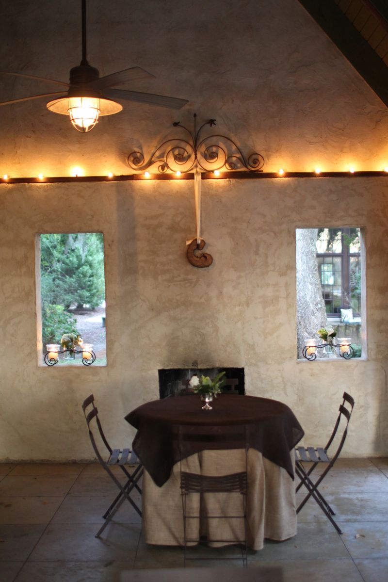 TABLE FOR TWO: Cocktail tables turned RiverOak’s rustic loggia into a lounge area.