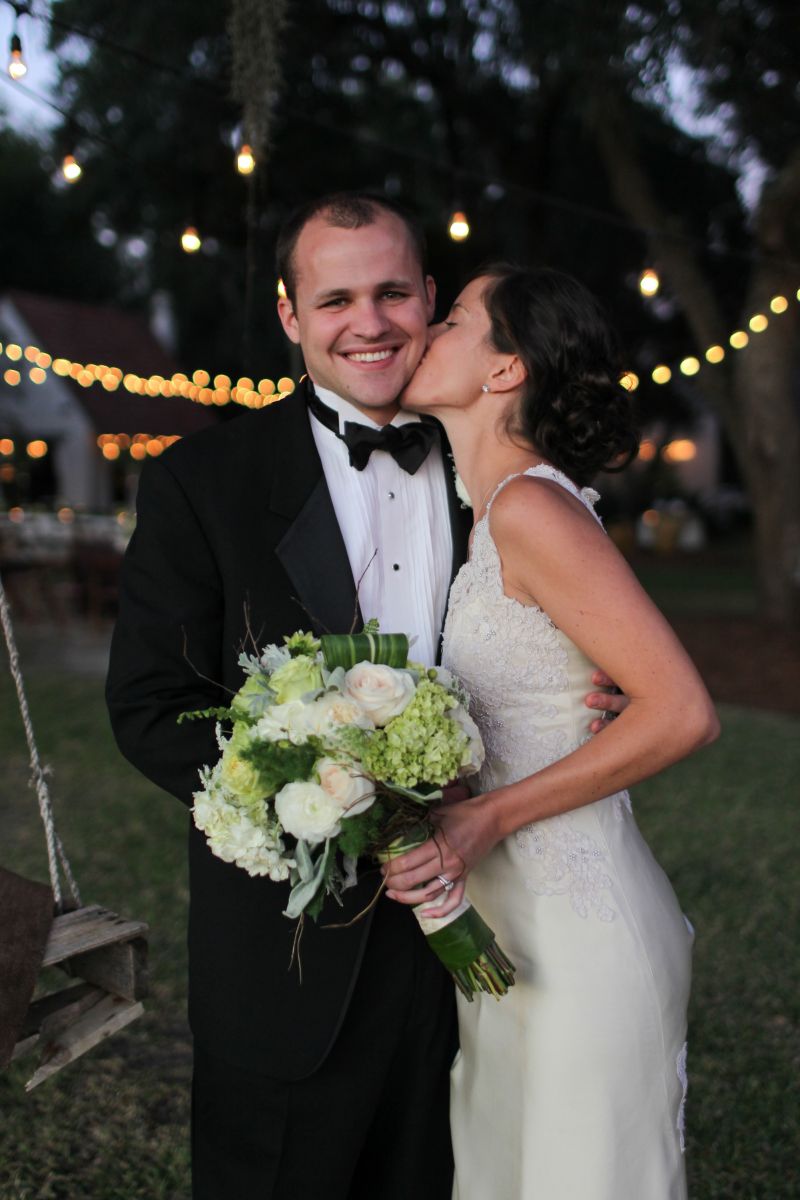 SHOW SOME LOVE: Logan wore her mother’s vintage wedding gown; Mark, a classic tux from Jean’s Bridal.